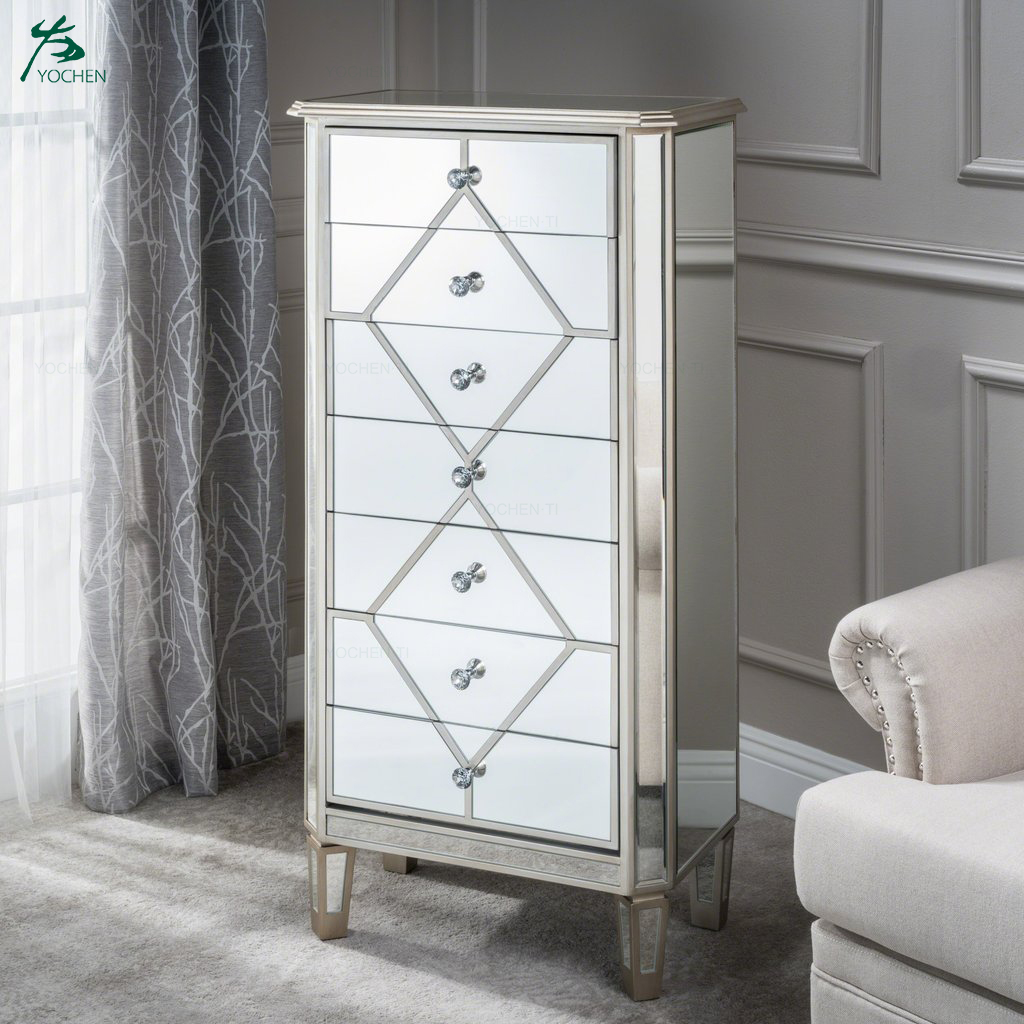 Silver finished mirrored 7 drawer cabinet with faux wood frame